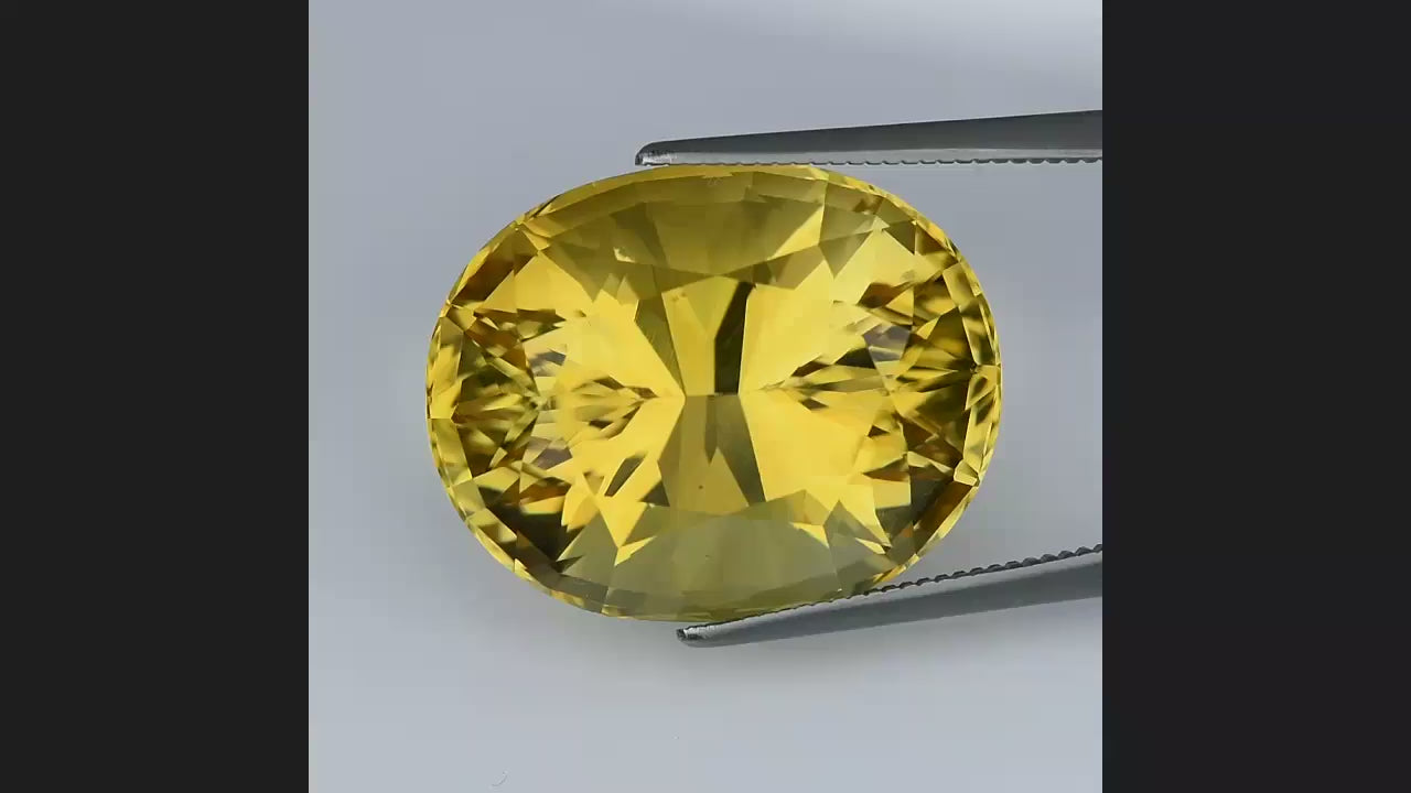 Natural citrine, 21.65 carats, oval cut, VVS clarity, heated, yellow