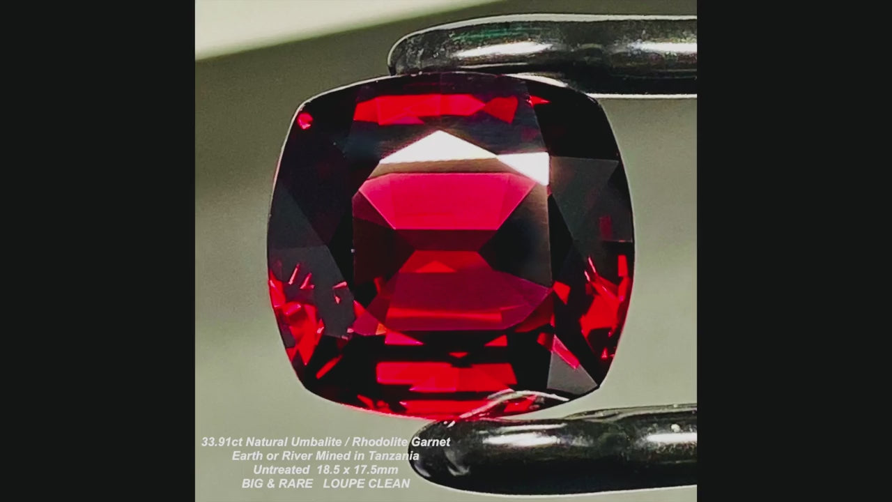 Natural almandine garnet, 33.92 carats, cushion cut, VVS clarity, untreated, certified, dark purplish-red, Madagascar