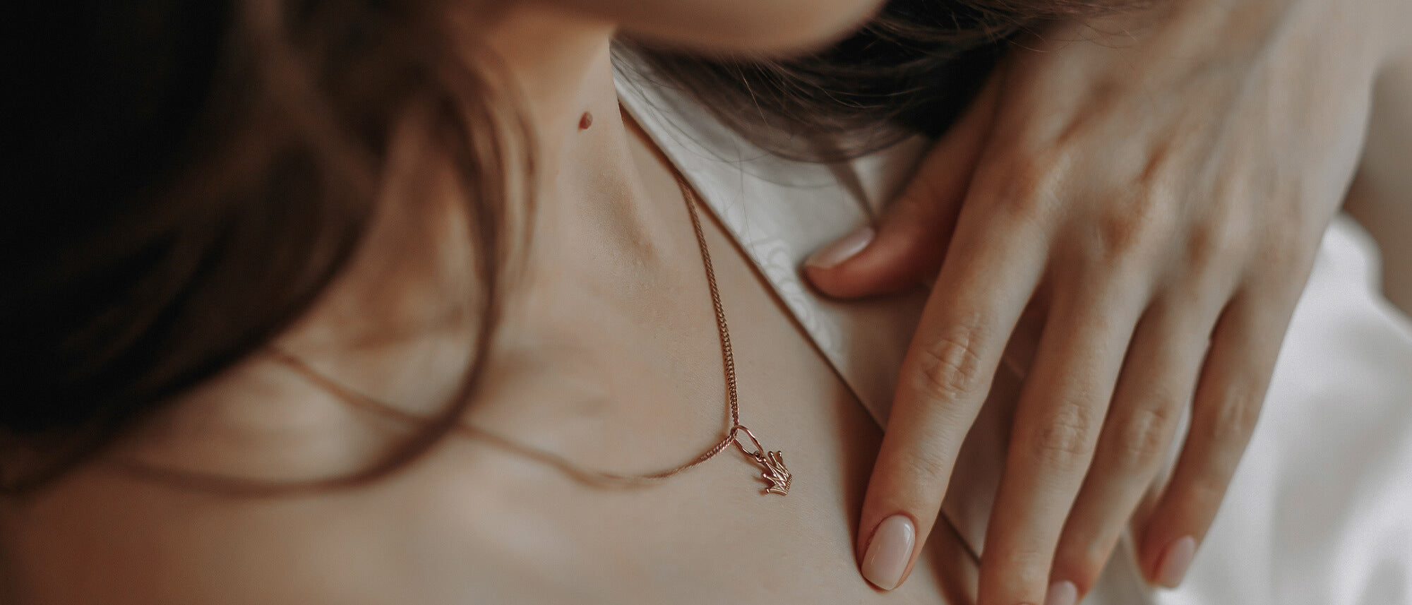 Closeup woman wearing pendant 