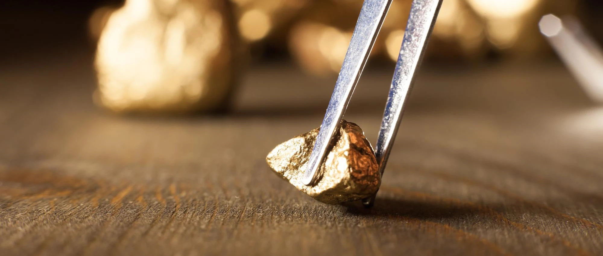 Gold raw material ond wooden table