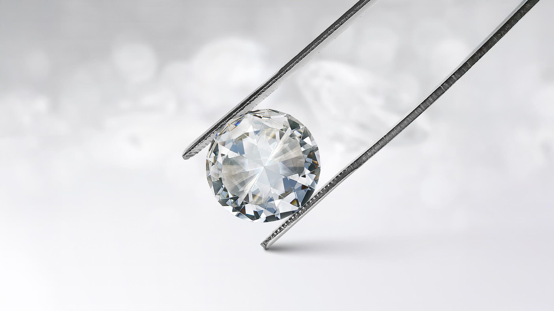 Natural diamond in tweezers on white background